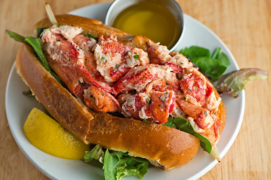 Exceptional and Elegant Flavors - Lobster Roll with lemon and sauce